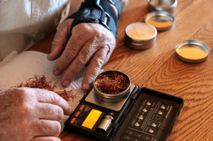 Farmer Joe Kroon weighs saffron threads harvested from his farm on the outskirts of Graaff Reinet