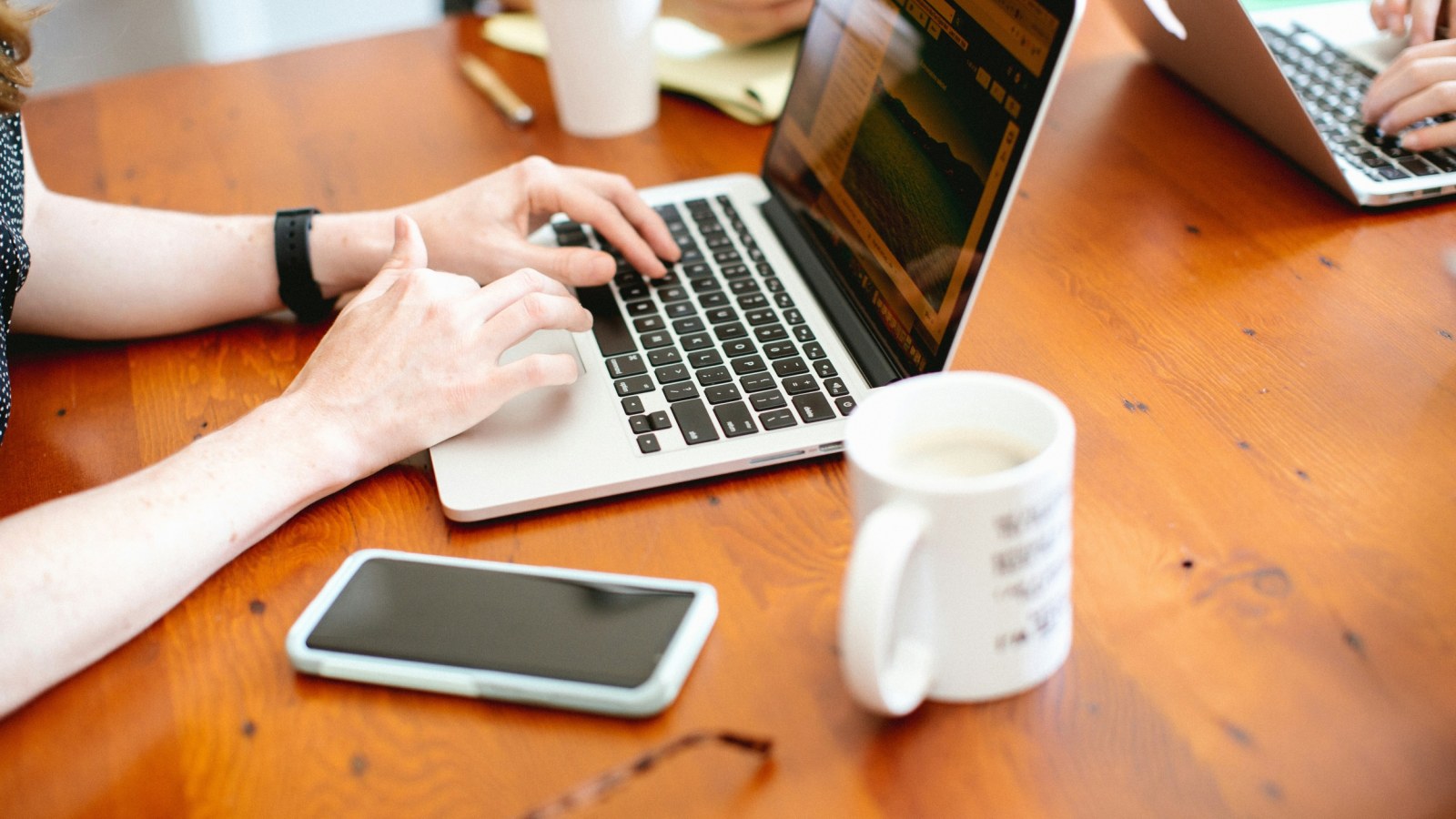 https://d.ibtimes.com/en/full/4604365/close-people-working-laptops-wooden-table.jpg?w=1600&h=900&q=88&f=94744442a58f2c6aec7a717709be3c5a