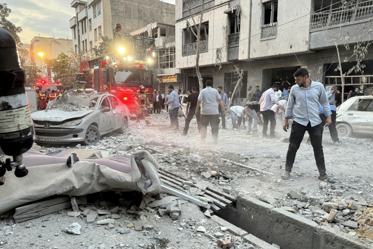 https://d.ibtimes.com/en/full/4604545/irans-emergency-services-respond-israeli-air-strike-which-reduced-much-tehran-residential.jpg