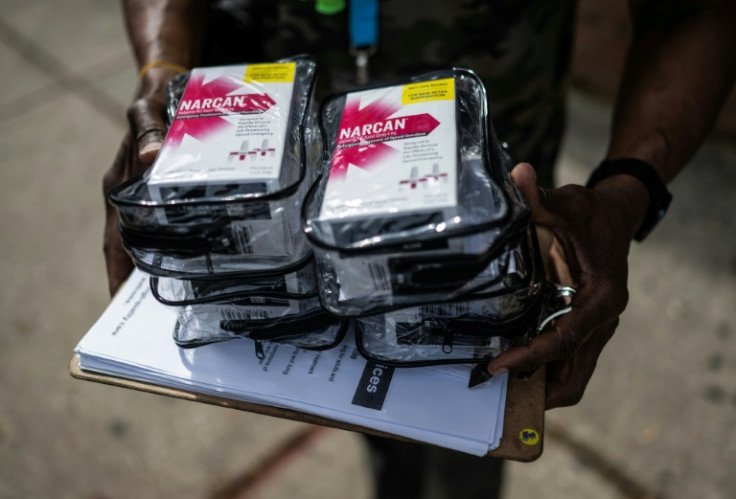 Dexter Daniel, a Peer Recover Coach at Our Daily Bread Employment Center (ODBC) with the Catholic Charities, holds boxes of Narcan to hand out on a street in Baltimore, Maryland on June 10, 2025