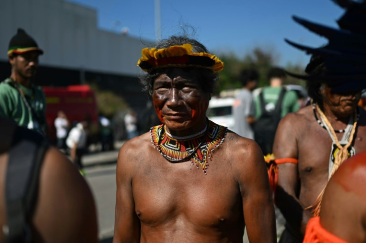 Indigenous people take part in a demonstration in front of the hotel in Rio de Janeiro where an oil blocks auction is taking place