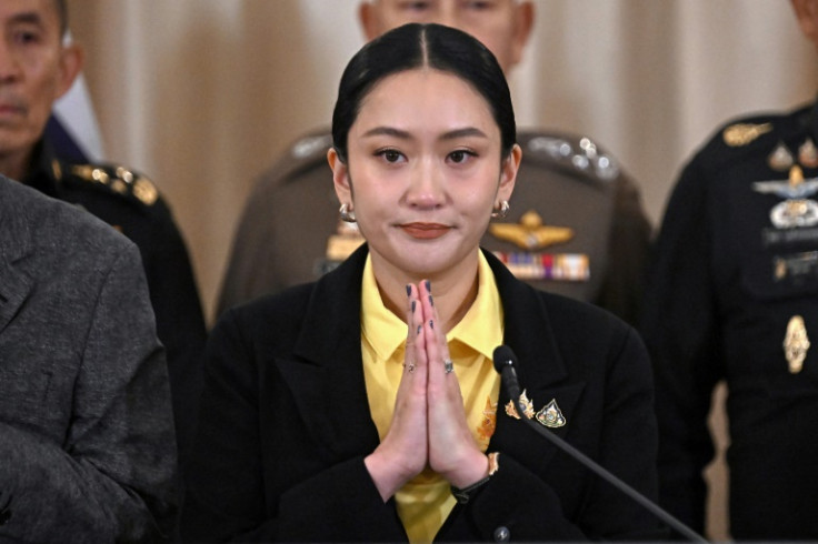 Thailand's PM Paetongtarn at a press conference surrounded by senior Thai army commanders and government minsters