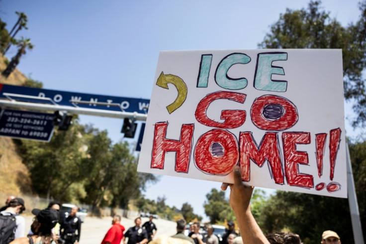 Demonstrators gathered near an entrance at Dodgers Stadium to protest any possible use as a staging ground for federal immigration agents