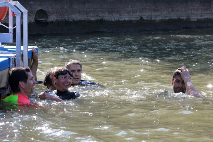 Paris Mayor Anne Hidalgo bathes in the Seine with then President of the Paris Olympic Committee Tony Estanguet.