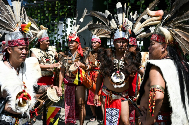 Indigenous Iban men gather during the Gawai Dayak Culture Parade in Kuching