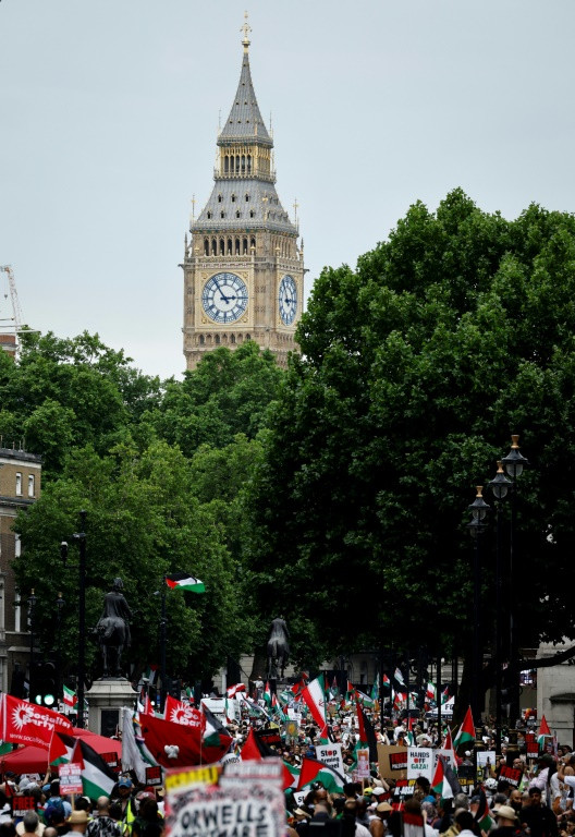 Protesters in London waved Palestinian flags and carried signs including 'Stop arming Israel' and 'No war on Iran'