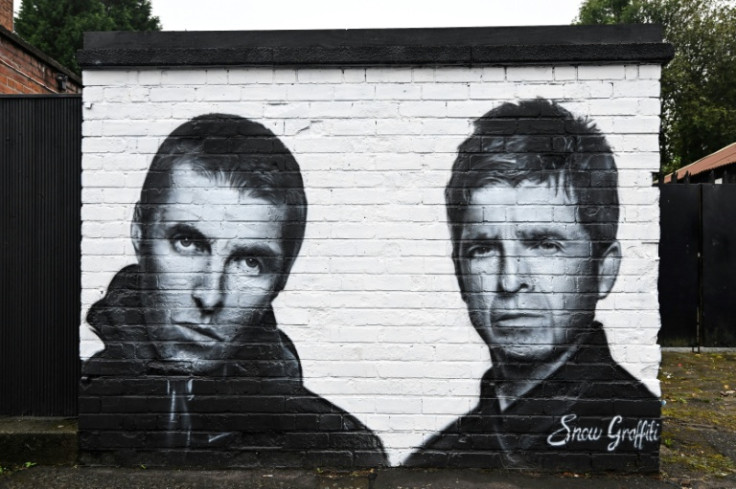 A mural by the artist known as Snow Graffiti of Liam and Noel Gallagher outside the Whitefield pub in Manchester, where they will play in July
