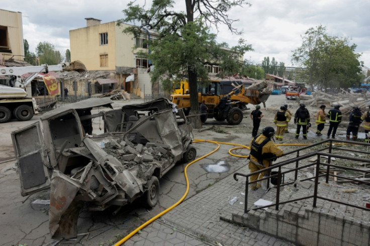 Rescuers and police at a damaged residential building following a Russian strike on Kramatorsk on June 22