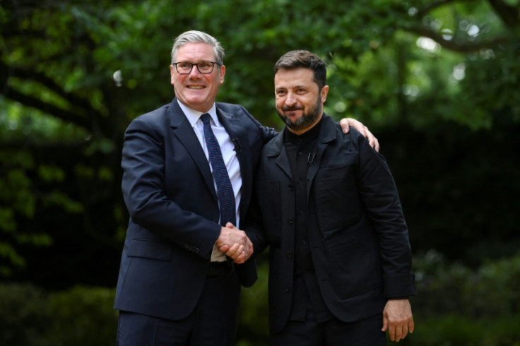 Britain's Prime Minister Keir Starmer (L) shakes hands with Ukraine's President Volodymyr Zelensky at 10 Downing Street, central London, on June 23, 2025