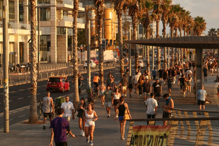 Isareli youth returned to Tel Aviv's beach promenade after the ceasefire was announced