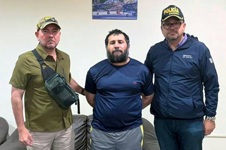 Accused drug trafficker Adolfo Macias (C), alias Fito, being guarded by Ecuador's Defense Minister Gian Carlo Loffredo (L) and Ecuador's Interior Minister John Reimberg after his recapture