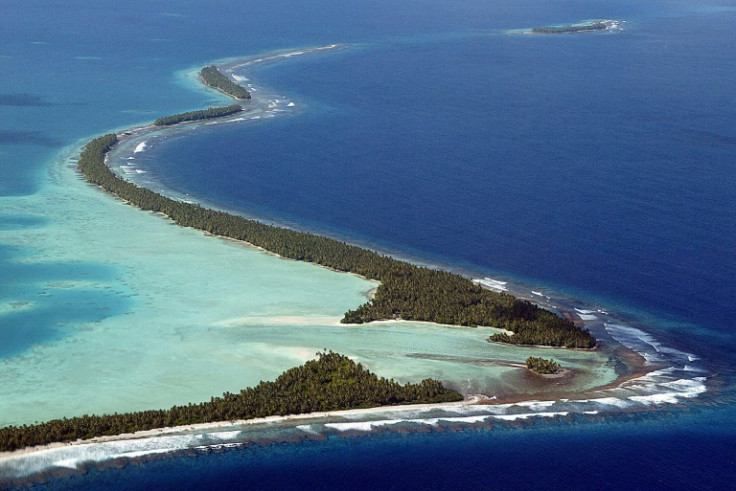 (FILES) A file photo taken on February 19, 2004 shows the serpentine coastline of Funafuti Atoll, home to nearly half of Tuvalu's entire population of 11,500, as king tides threaten to inundate the tiny island nation. The Pacific nation of Tuvalu was once