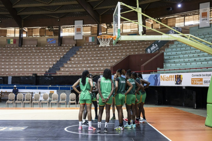 Players for the Senegal team listen to one of their coaches during training on June 25, 2025