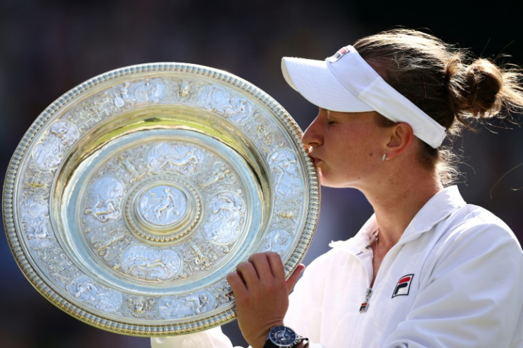 Barbora Krejcikova with the Venus Rosewater Dish at Wimbledon in 2024
