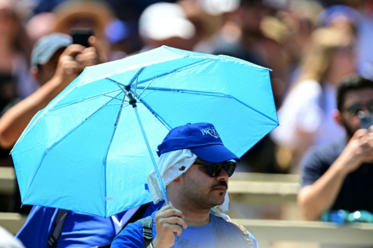 Several people used parasols to hear Pope Leo XIV's address at St Peter's square in the Vatican on Sunday