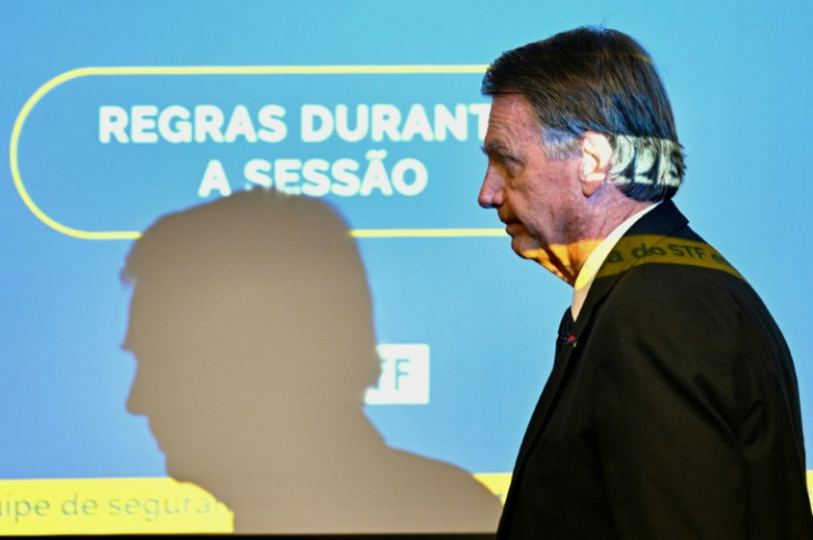 Former Brazilian President Jair Bolsonaro leaves the court room after taking the stand for the first time in his Supreme Court trial for allegedly plotting a coup in January 2023, in Brasilia, June 10, 2025