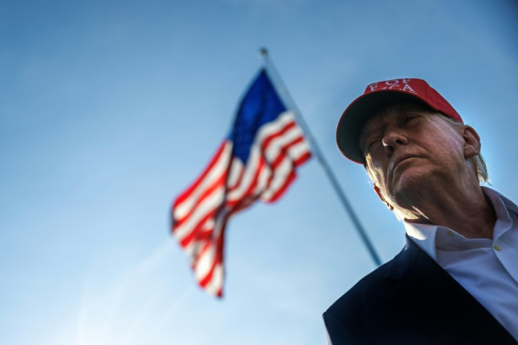 US President Donald Trump talks to members of the press as he departs from the South Lawn of the White House in Washington, DC on July 1, 2025
