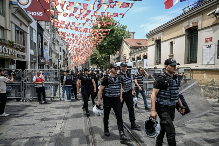 Turkish riot police fanned out around Taksim Square and Istiklal Avenue, putting up metal barricades to prevent any protests