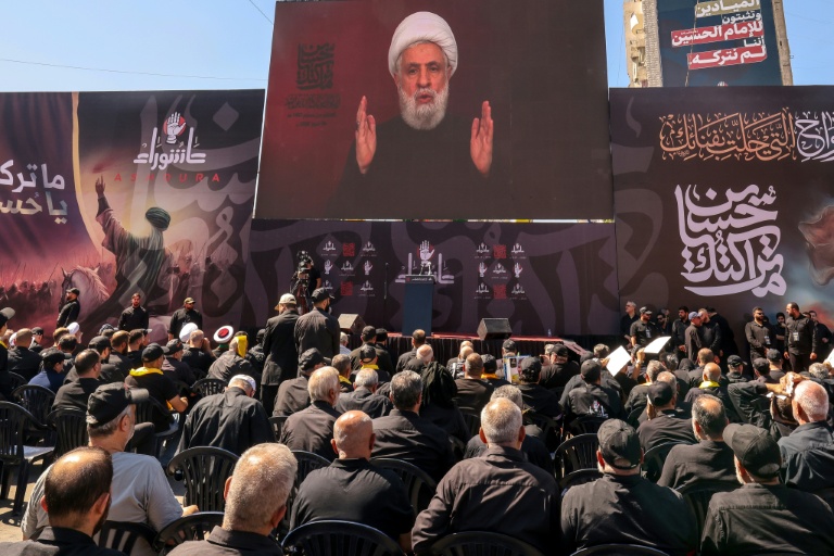 https://d.ibtimes.com/en/full/4609243/lebanese-shiite-hezbollah-supporters-listen-televised-speech-movement-leader-naim-qassem.jpg