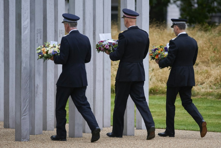 Senior police officers lay wreaths at the memorial to the July 7 bombing victims in London's Hyde Park