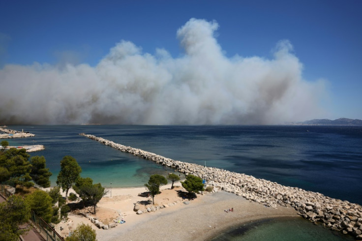 A fire in the nearby town of Pennes-Mirabeau sent plumes of acrid smoke billowing over Marseille