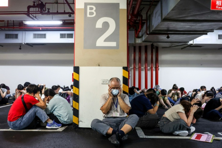 Taipei came to a brief standstill when air raid sirens forced people off the streets and into underground shelters in a rehearsal for a Chinese attack