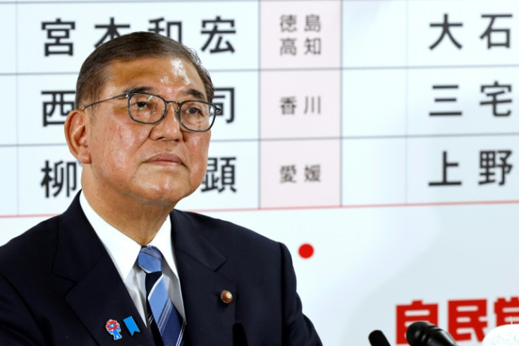 Japan's Prime Minister Shigeru Ishiba addresses the media after his coalition lost its upper house majority in elections