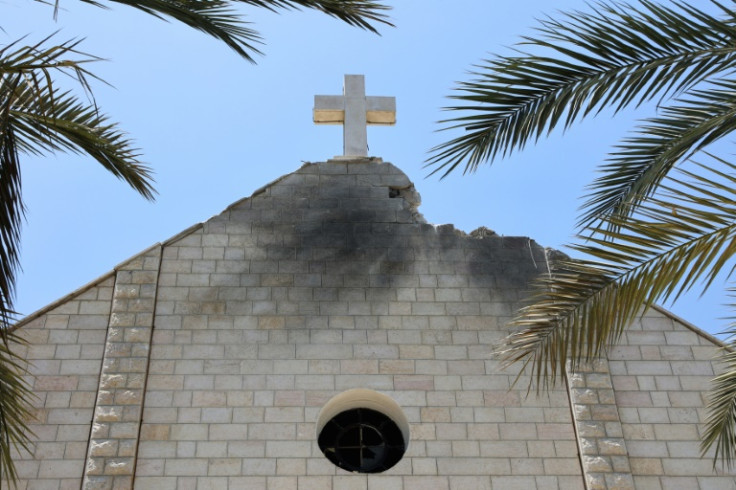 The damaged facade of the Holy Family Church in Gaza after it was hit by an Israeli strike