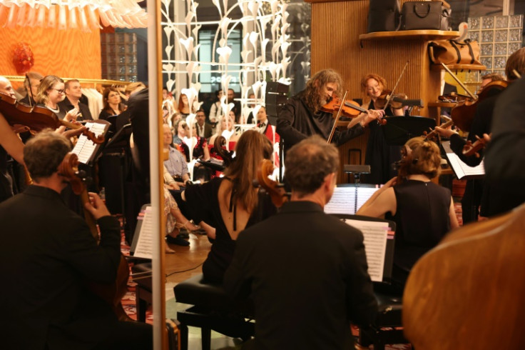 The Versailles Royal Opera Orchestra performs at the Printemps store in Lower Manhattan July 21, 2025 during a show called "Versailles in Printemps: The Affair of the Poisons"