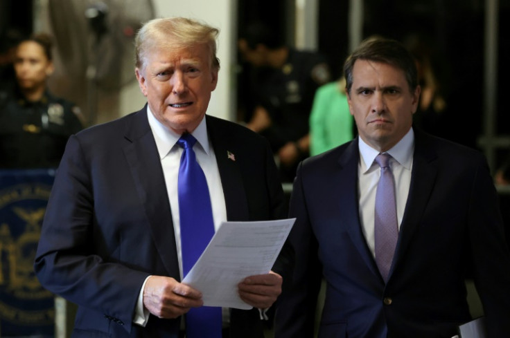 President Donald Trump, flanked by his lawyer Todd Blanche, speaks to reporters at his hush money trial in New York in May 2024