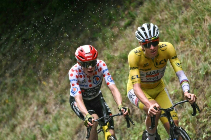 Slovenian Tadej Pogacar in the leader's yellow jersey is followed by Danish rival Jonas Vingegaard in the best climber's polka dot jersey in the final ascent of La Plagne on the last day in the Alps