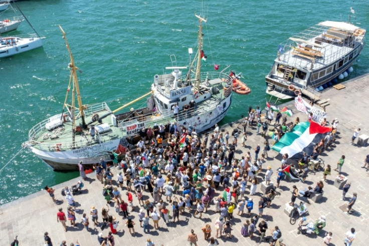 Pro-Palestinian activists gather on the dockside in Italy earlier this month to watch the Hamdala set sail for Gaza in a symbolic bid to breach Israel's blockade.