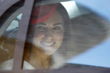 Kate Middleton, the Duchess of Cambridge, glances out of her car window