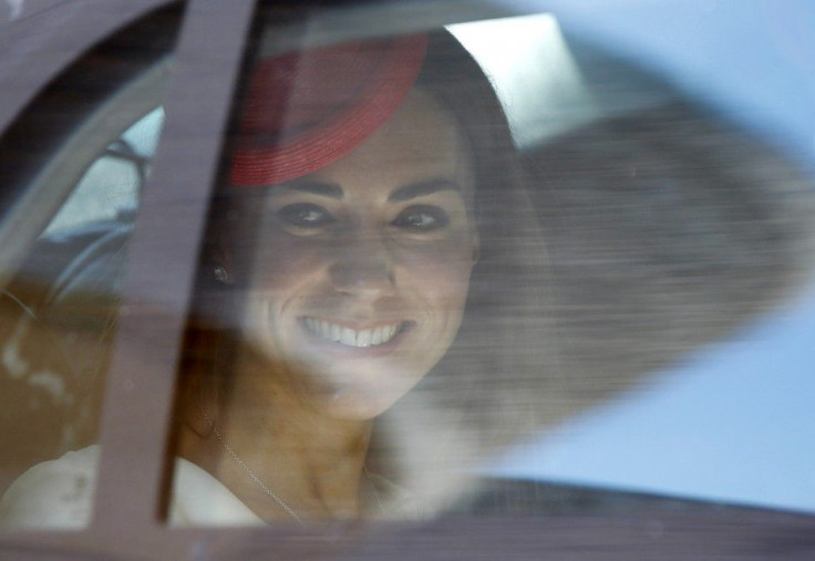 Kate Middleton, the Duchess of Cambridge, glances out of her car window