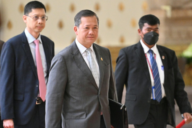 Cambodia's Prime Minister Hun Manet (C) will meet Thailand's acting Prime Minister Phumtham Wechayachai to discuss a ceasefire