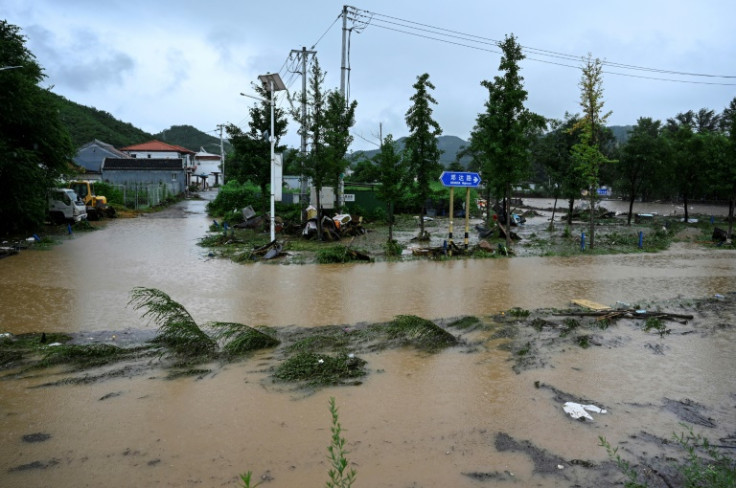 A flooded street is seen after heavy rains at Xin'anzhuang village, in Miyun district, on the outskirts of Beijing on July 28, 2025