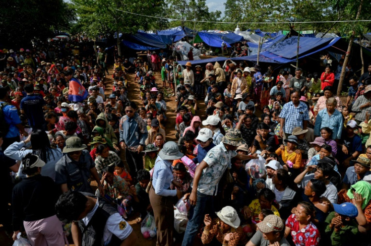 Displaced people gather at a food distribution site in Oddar Meanchey province of Cambodia on July 28, 2025