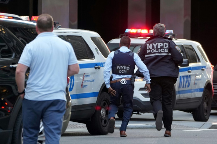Police repeatedly pushed back journalists and members of the public who gathered to see what was happening