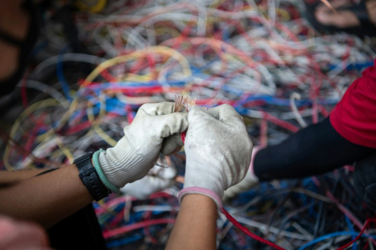 Stripping scrapped laptops and air conditioners for metal frequently involves burning away rubber wire casings, releasing a toxic brew of chemicals including lead, mercury and cadmium into the air