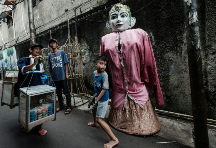 The planned ban has left authentic ondel-ondel performers and makers torn about the preservation of their culture and the plight of the buskers