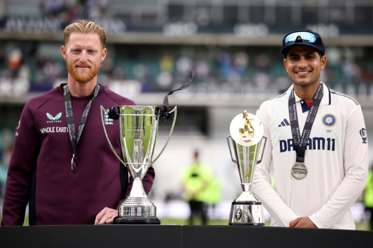 Team captains, England's Ben Stokes (L) and India's Shubman Gill (R) pose with the Rothesay and Anderson-Teldulkar trophies after the sides draw the test series 2-2 at The Oval in London