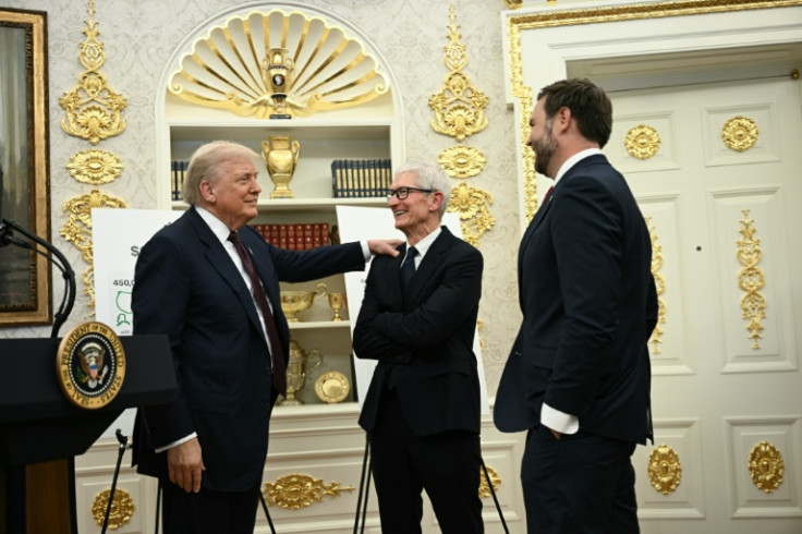 Apple, whose chief executive Tim Cook (C) met with President Donald Trump in the White House, is substantially boosting its investment commitment in the United States