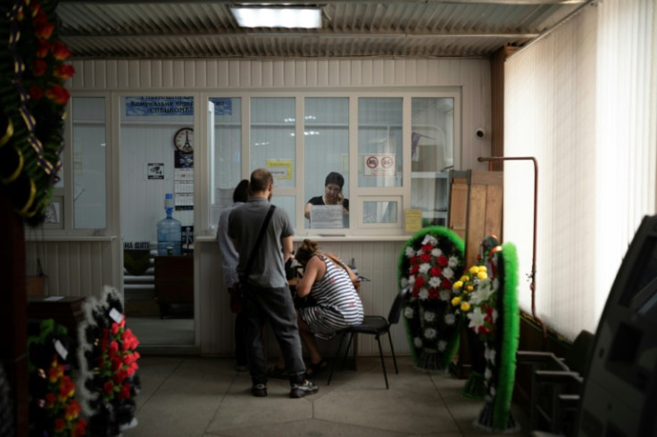 Ostapenko prepares funeral arrangements for a family whose son was killed at the front in Sumy