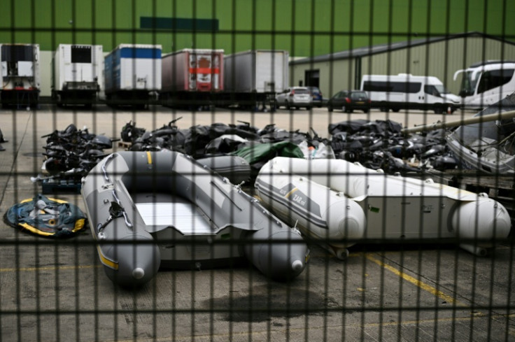 Inflatable dinghies and outboard engines, used by migrants attempting to cross the English Channel from France, are pictured in south-east England