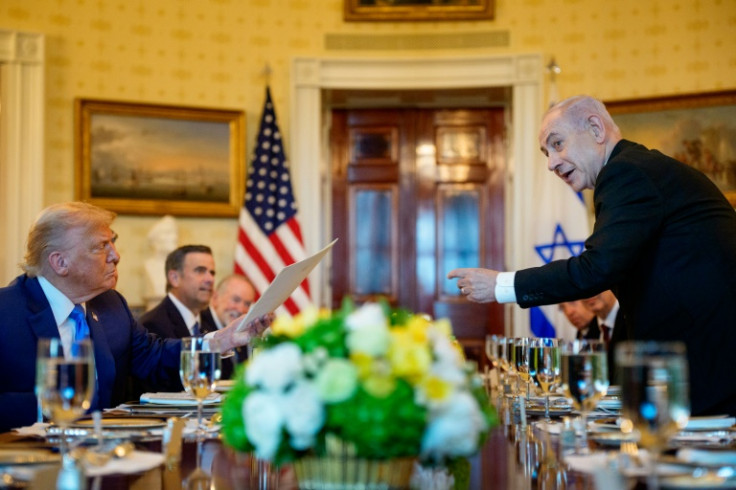 Israeli Prime Minister Benjamin Netanyahu (R) presents a copy of a letter he sent to the Nobel Committee to nominate US President Donald Trump (L) for the Nobel Peace Prize