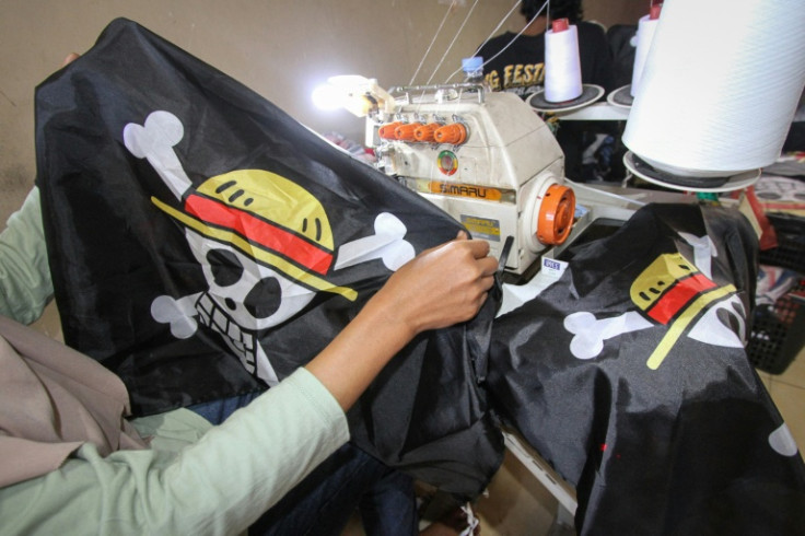 A factory owner says plain-clothes police raided his facility to stop production of the emblem