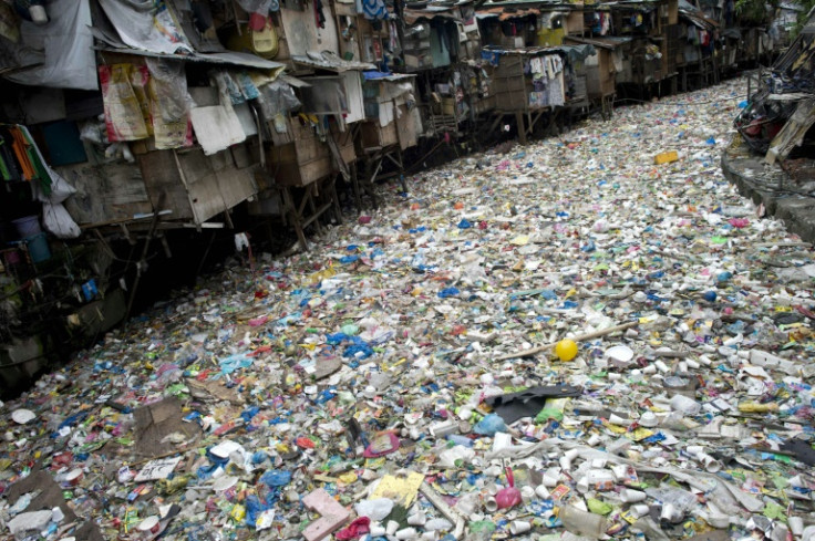 A river filled with garbage in Manila. Talks on a global treaty to combat plastic pollution are coming to the crunch