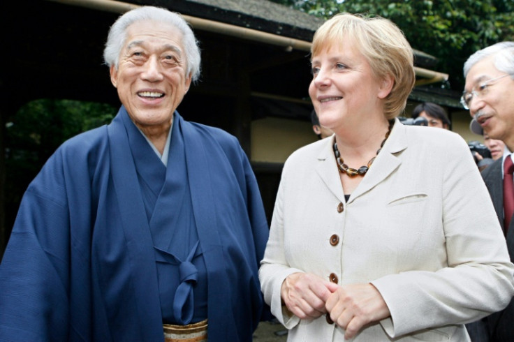 Sen Genshitsu, pictured in 2007 meeting Germany's then chancellor Angela Merkel, stressed the calming effects of tea culture