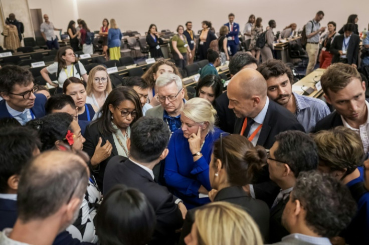 Delegates speak after talks on a global treaty on combating plastic pollution were extended an extra day in Geneva