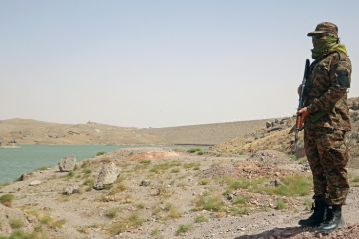 A member of Taliban security forces stands guard near the Pashdan Dam, also known as Band-e Pashdan, in Herat province